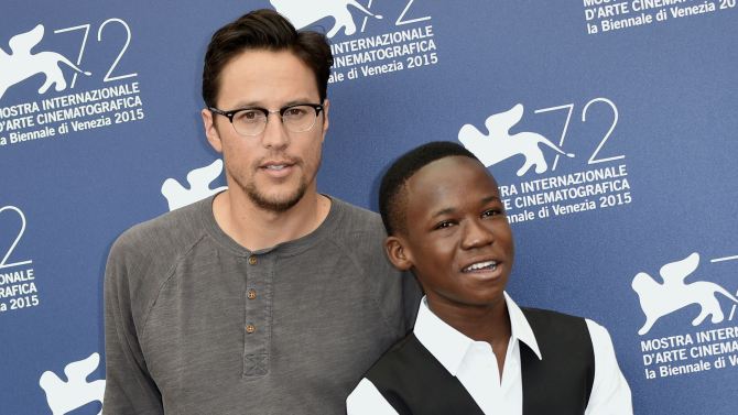 Mandatory Credit: Photo by AGF s.r.l./REX Shutterstock (5036354m) The director Cary Fukunaga, Abraham Attah 'Beasts of no nation' photocall, 72nd Venice Film Festival, Italy - 03 Sep 2015
